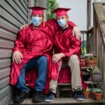 graduates with masks